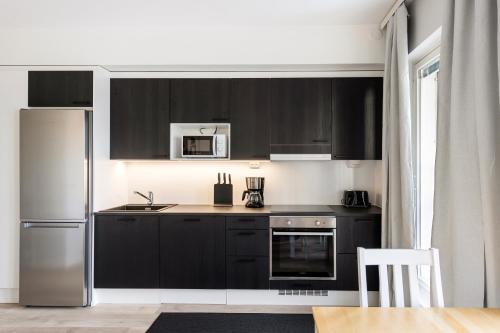 Dapur atau dapur kecil di Kotimaailma Apartments Loimu VII