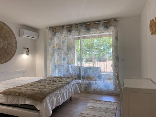 Postel nebo postele na pokoji v ubytování T2 bord du canal du midi piscine