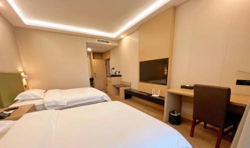 Μια τηλεόραση ή/και κέντρο ψυχαγωγίας στο Jinrui Sunshine Hotel Pengzhou