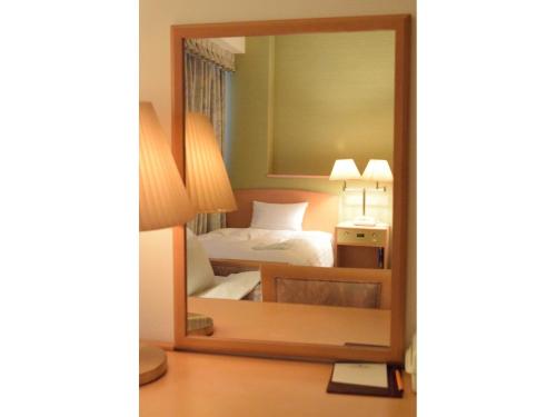 En eller flere senge i et værelse på Bright Park Hotel - Vacation STAY 67836v