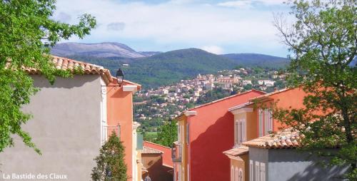 a view of a town with mountains in the background at Lagrange Vacances Domaine de Fayence in Fayence