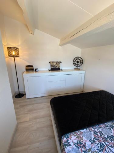 Η κουζίνα ή μικρή κουζίνα στο Appartement Duplex Climatisé Le Trident