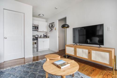 A television and/or entertainment centre at Well-located S Boston 1BR on E Broadway BOS-474