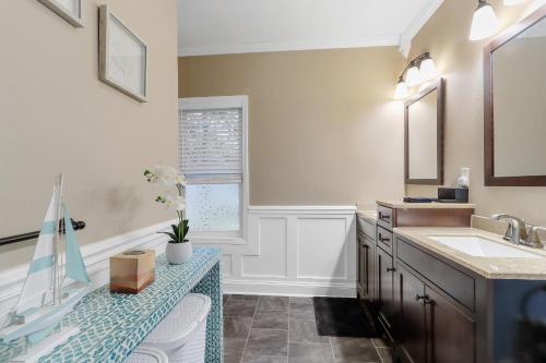 a bathroom with a sink and a counter top at New Pet Friendly Walking Distance to Lake Front in Lake Geneva