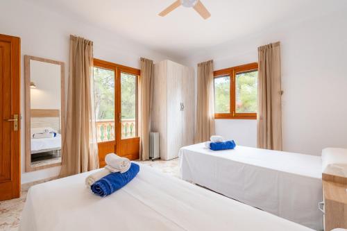 A bed or beds in a room at Finca Bosc de Can Alou by Mallorca House Rent