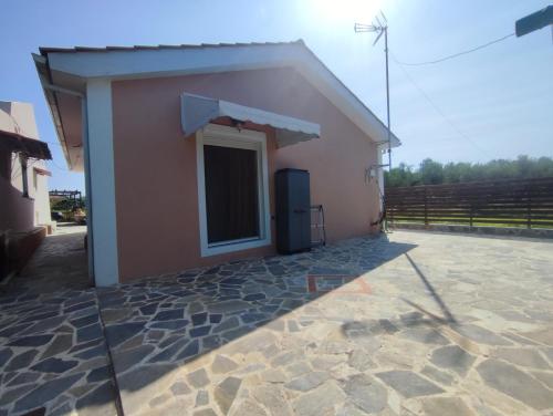a new house with a large yard at Feels like home. in Koukounariá