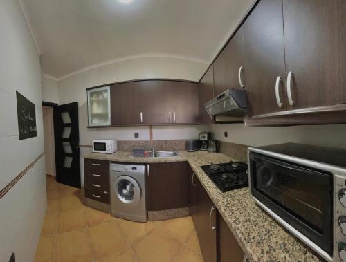 Kuchyň nebo kuchyňský kout v ubytování Appartement Haut Standing Les Dunes De Martil