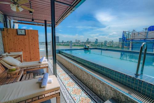 a swimming pool on the roof of a building at Phuminh Hotel Riverside in Phnom Penh