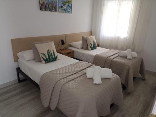 Posteľ alebo postele v izbe v ubytovaní Apartamento Maya Relax Salou