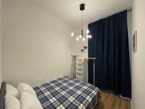Postel nebo postele na pokoji v ubytování Andrews Cosy Apartment