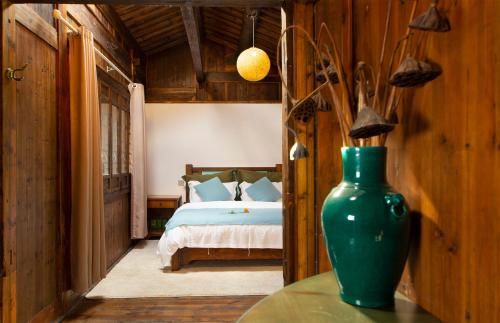 Postel nebo postele na pokoji v ubytování Alina Garden Boutique Resort Huangshan Hongcun