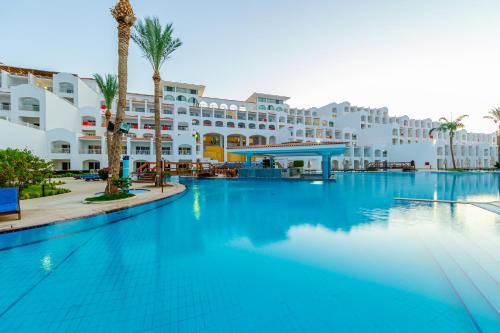 a large swimming pool in front of a hotel at Siva Sharm Resort & SPA in Sharm El Sheikh