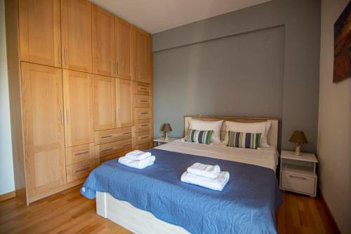 a bedroom with a bed with two towels on it at Ada's House 2 in Mytikas