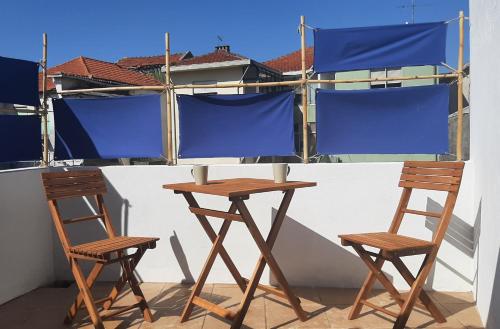 two chairs and a table on a balcony at taol in Vila Nova de Gaia