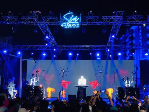 a crowd of people watching two singers on a stage at LUNA Residence Porto Golf Marina Sia Lagoon 2 Bedroom Challet with Garden Families only in El Alamein