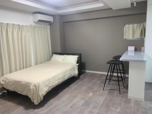 En eller flere senger på et rom på COPO YONEGAHAMA l 米が浜通