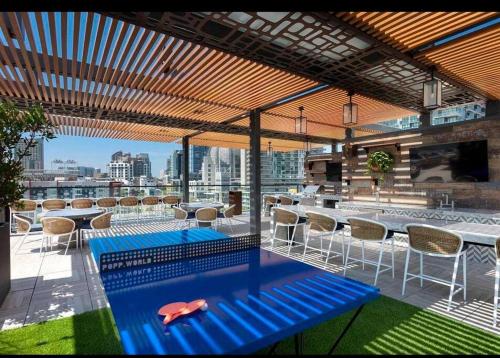 a swimming pool on the roof of a building at Lux Apt with Rooftop pool by Petco Park and Convention center 41 in San Diego