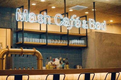 a restaurant with a sign that reads mass cafe and bed at Mash Cafe & Bed NAGANO in Nagano