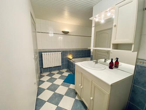 a bathroom with a sink and a mirror at Domaine de la Source in Sainte-Christie-dʼArmagnac