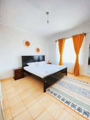 เตียงในห้องที่ The Loft Residence