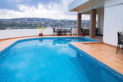 a swimming pool on the roof of a building at Gold Crest Hotel in Mwanza