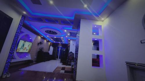 a room with purple lights on the ceiling at شقة فندقية اسكندر ابراهيم in Alexandria