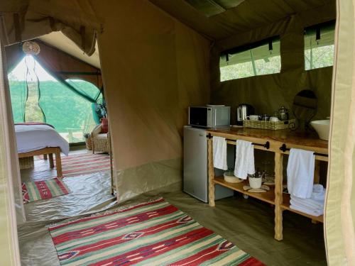 a view of a kitchen in a tent at Echoes of Eden: Forest Haven in Melewa
