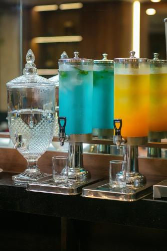 a couple of glasses of drinks on a bar at Hanoi La Palm Premier Hotel & Spa in Hanoi