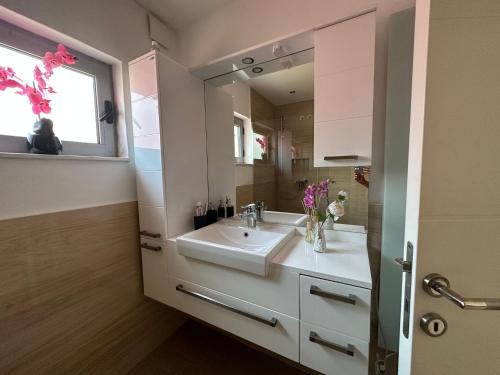 a bathroom with a sink and a mirror at Villa La Miga in Dobra Voda