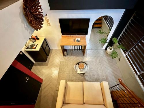 an overhead view of a living room with a couch and a table at Havitat Boutique Hotel in Manila