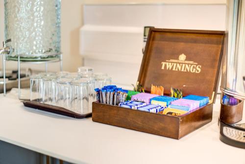 a wooden box of utensils sitting on a counter at Onich Hotel & Lochside Beach Pods in Onich