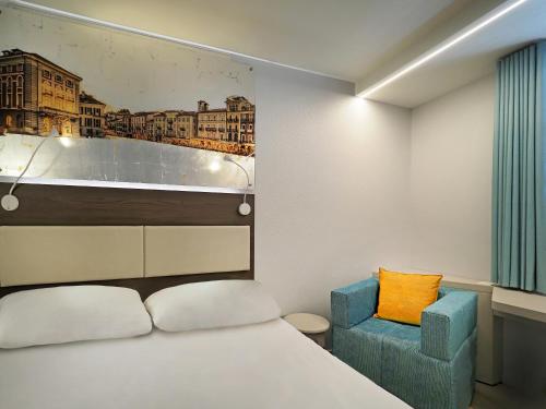 Ein Bett oder Betten in einem Zimmer der Unterkunft ibis Locarno
