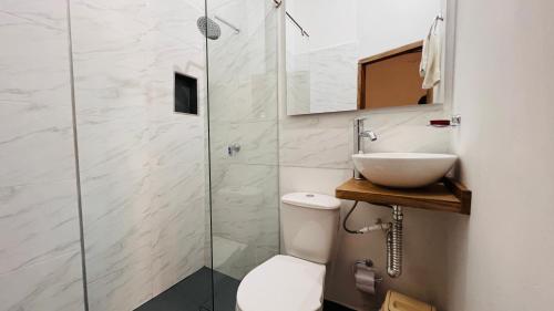 a bathroom with a sink and a toilet and a shower at Hotel Villa de Mompox in Mompos