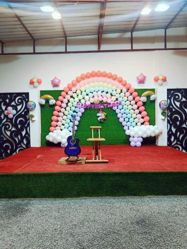 a room with an arch made out of balloons at Green Club Farm in Ajmer
