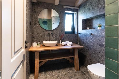 a bathroom with a sink and a mirror at Villa Val & Sol in Dubrovnik
