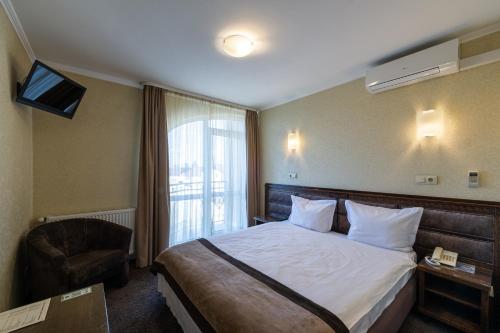 Postel nebo postele na pokoji v ubytování Avalon Palace