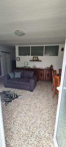 a living room with a couch and a table at Da Ersilia in Cernobbio