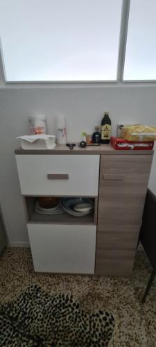 a small white counter with a sink and a window at Da Ersilia in Cernobbio