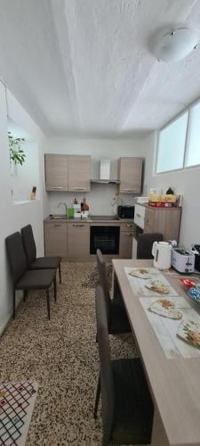 a kitchen with a table and chairs in a room at Da Ersilia in Cernobbio