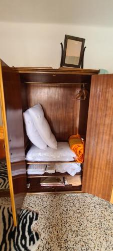 a bunk bed with pillows and a mirror in a room at Da Ersilia in Cernobbio
