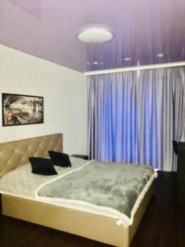 Katil atau katil-katil dalam bilik di Luxury for Business & Pleasure Royal