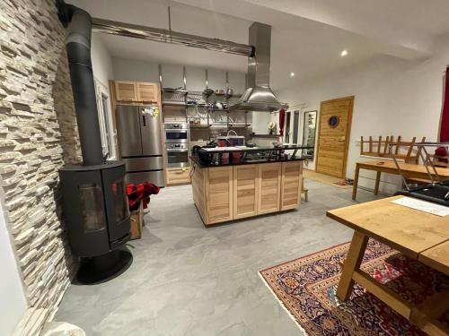 a large kitchen with a stove in a room at VILLA NOVA Leros in Drymonas