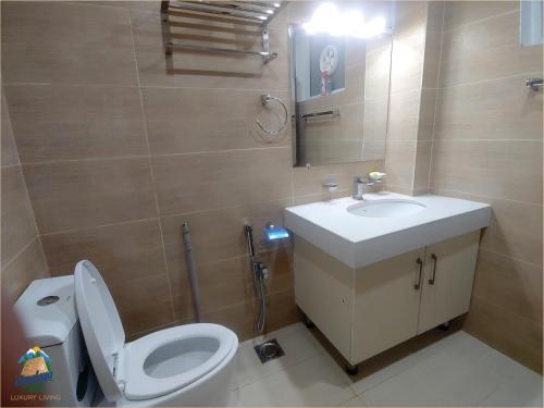 a bathroom with a toilet and a sink at Himalaya Villas in Murree