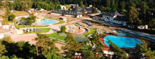 an aerial view of a resort with two swimming pools at Złotopolska Sielanka in Załuski