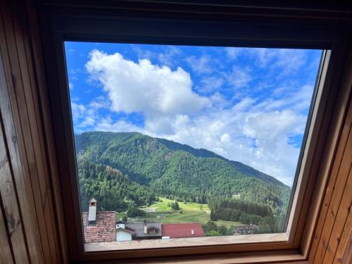a window with a view of a mountain at La Vita in Ravascletto