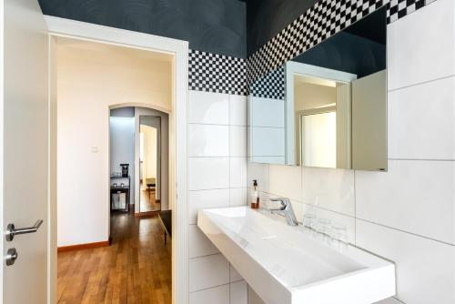 a bathroom with a sink and a mirror at Hotel Würzburger Hof **** in Würzburg