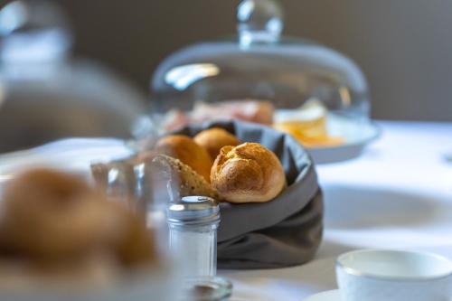 a basket of bread sitting on top of a table at Sa Suites in Trepuzzi