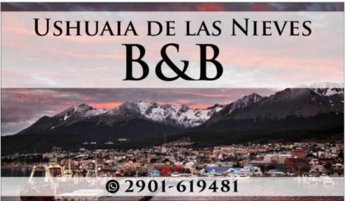 a poster with a picture of a city and mountains at Ushuaia de las Nieves B&B in Ushuaia