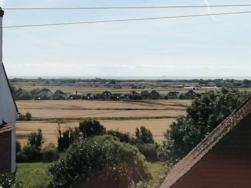 a view of the fields from a house at Cadborough Cliff Apartment in Rye