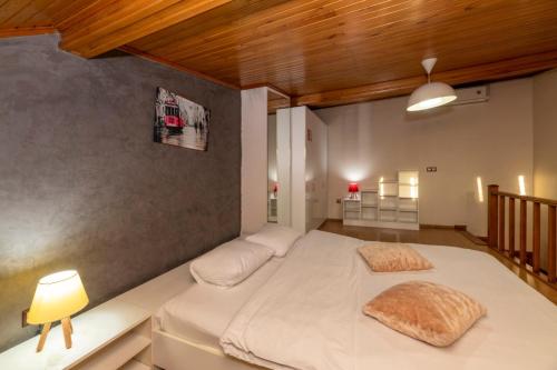 a bedroom with a bed with two pillows on it at Taksim full House in Istanbul